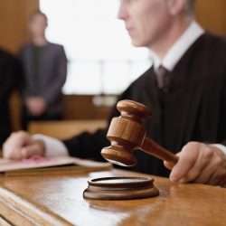 Defense lawyer consulting polygraph examiner in legal case