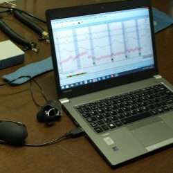 Polygraph accuracy chart with examiner analyzing data